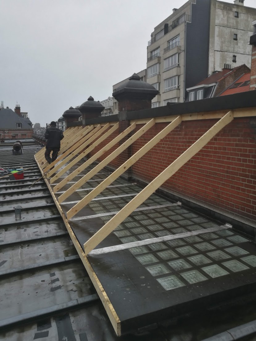 Building the wooden roof structure in the rain