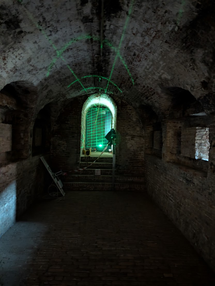 Underground brick tunnel with projector alignment grid