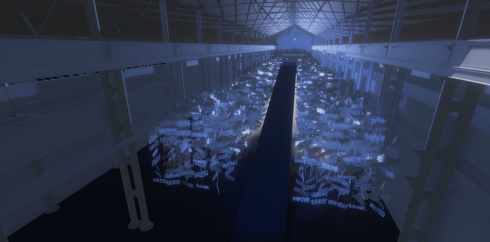 From the walkway above: the visitor route cuts through the sheet of words along its whole length.