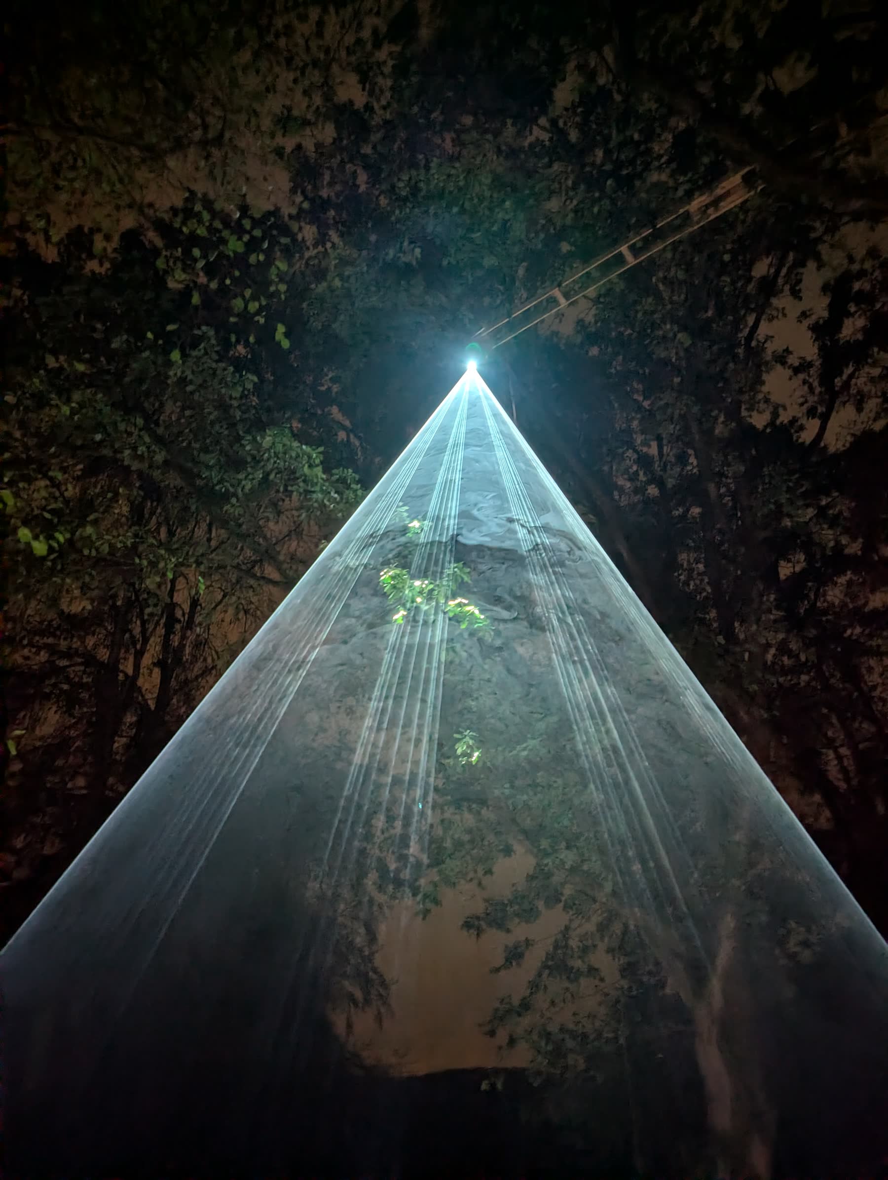 Cone of laser beams seen from the ground